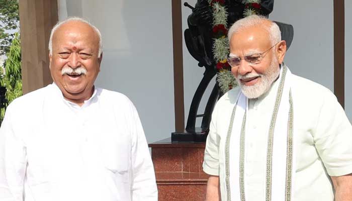 Indian Prime Minister Narendra Modi (right) pictured with RSS chief Mohan Bhatwat. — DD News/Archive