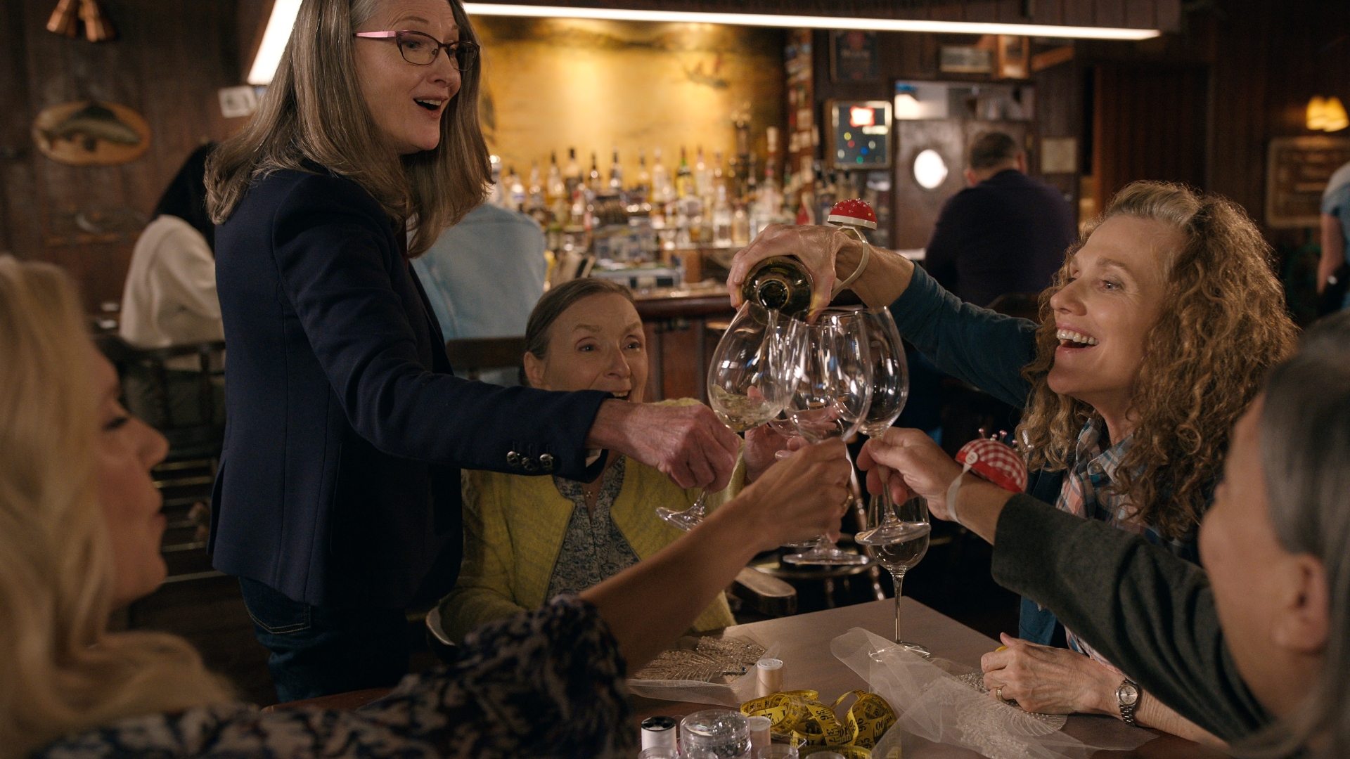 The ladies applaud at the Virgin River bar.