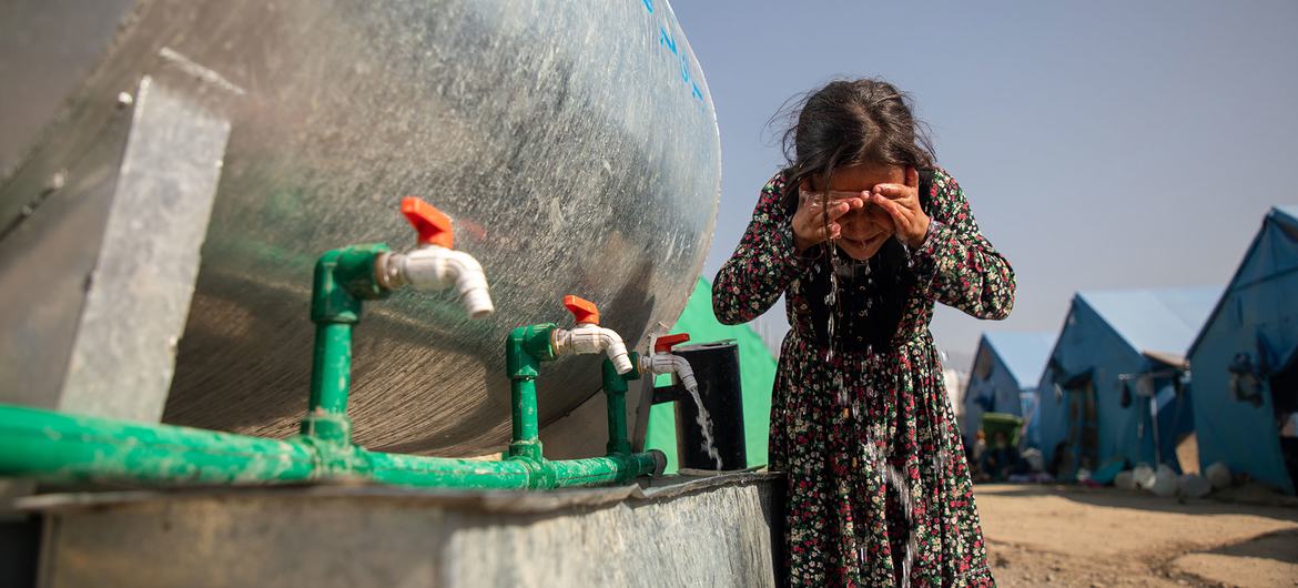 A girl washes her face in a camp for people displaced by the earthquake in Kunar province, Afghanistan. A girl washes her face in a camp for people displaced by the earthquake in Kunar province, Afghanistan.