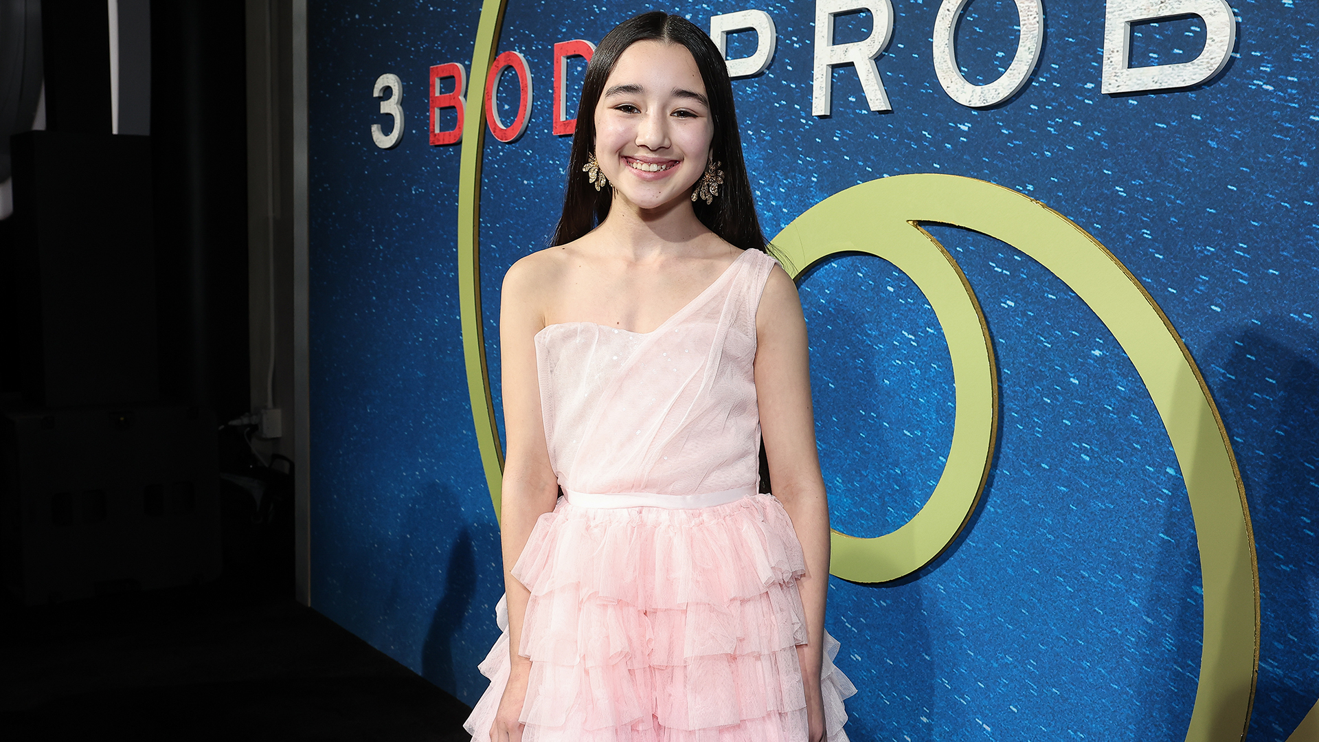 Eve Ridley posing for a photograph at the premiere of the 3 Body of Netflix Problems'