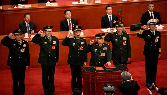 Zhang Youxia (front), vice chairman of the Central Military Commission of the People's Republic of China, takes the oath with Central Military Commission members (left) Zhang Shengmin, Liu Zhenli, He Weidong, Li Shangfu and Miao Hua, after they were elected on March 11, 2023.— Reuters