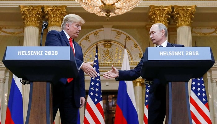 President Donald Trump and Russian President Vladimir Putin shake hands during a joint news conference after their meeting in Helsinki, Finland, July 16, 2018. - Reuters