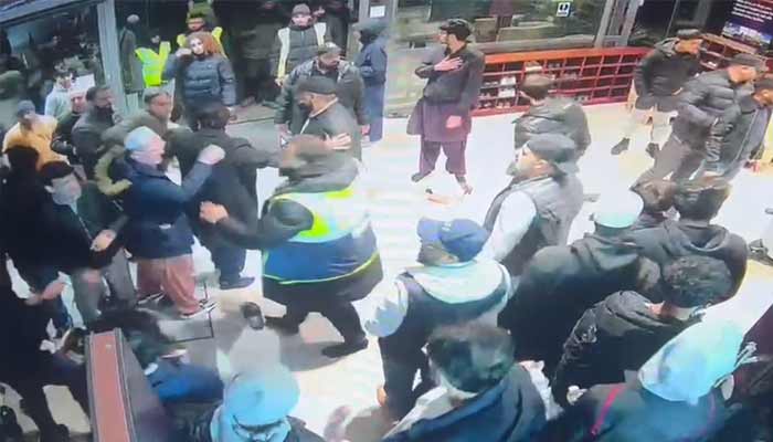 A fight breaks out at the Hounslow mosque, west of London, England. — Screenshot via CCTV footage