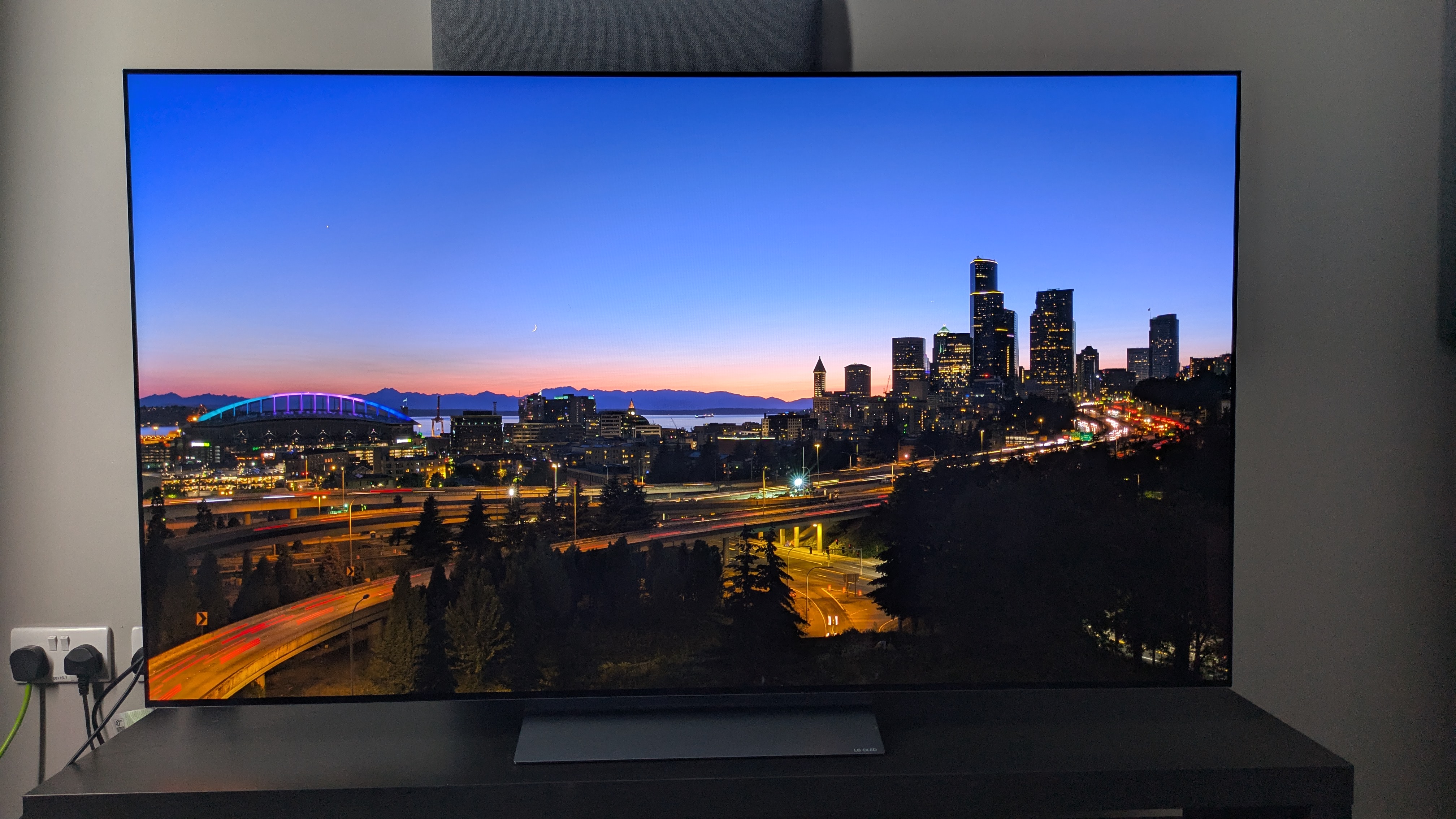 LG C5 with a night city landscape shot on the screen