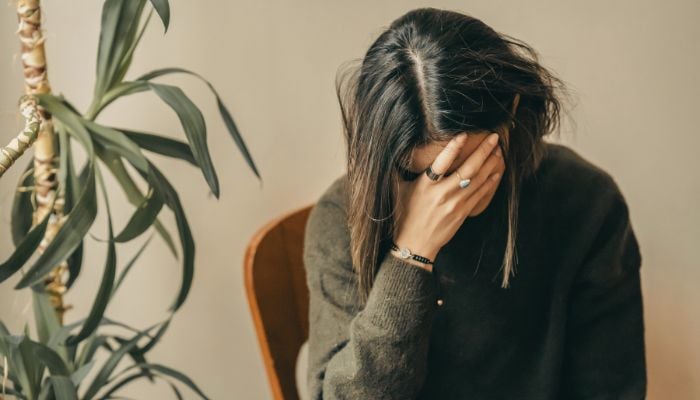 A representative image of a worried woman. —Canvas