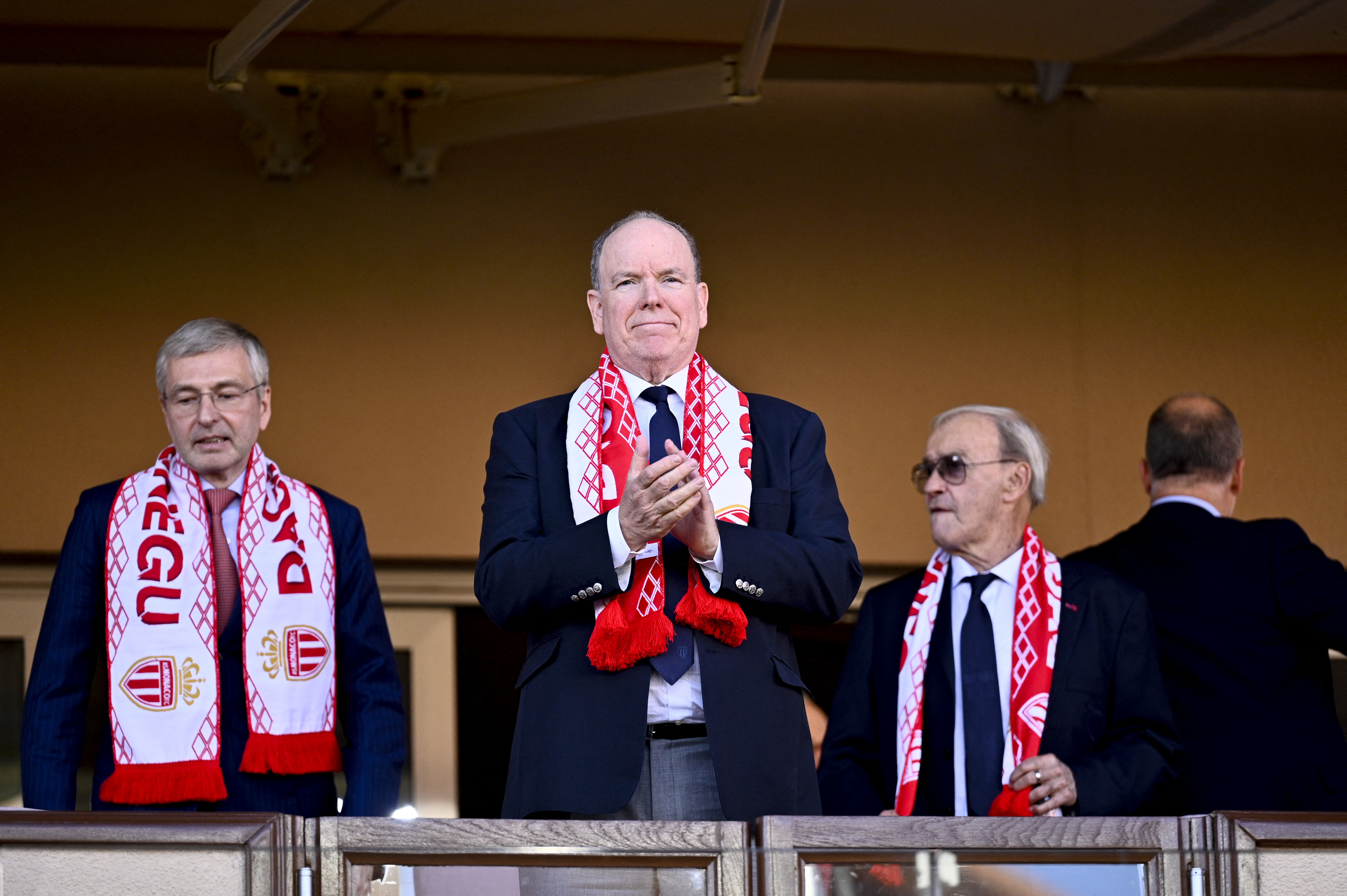 Prince Albert II of Monaco (C) and AS Monaco president Dmitri Rybolovlev (L) attend the French L1 soccer match between AS Monaco and OGC Nice at the Stade Louis II in the Principality of Monaco on October 5, 2025. (Photo by Frederic DIDES / AFP) (Photo by FREDERIC DIDES/AFP via Getty Images)