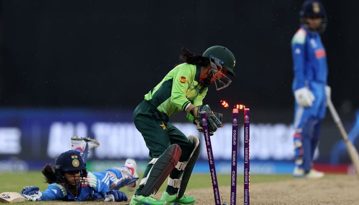 Pakistan's Wicktkeeper tries to touch an Indian batter during the ICC Women's World Cup match at the R. Colombo R.