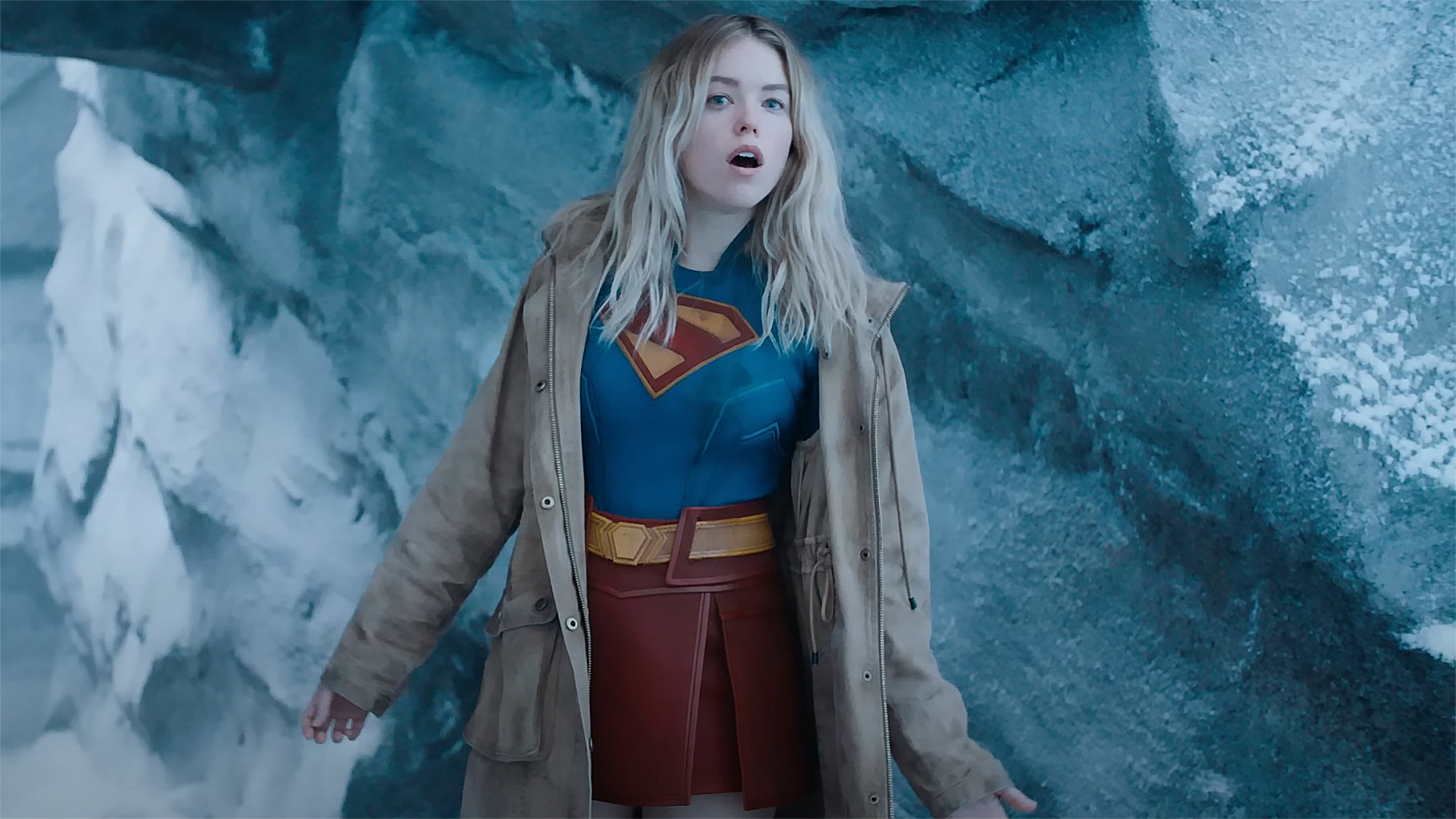 A screenshot of Kara Zor-El in her Supergirl costume and trench coat in the 2025 Superman movie