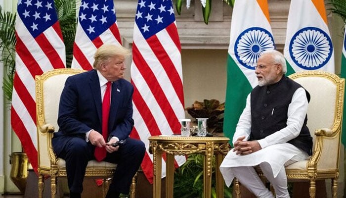 Indian Prime Minister Narendra Modi speaks with US President Donald Trump during a meeting at Hyderabad House in New Delhi, India, February 25, 2020. – Reuters
