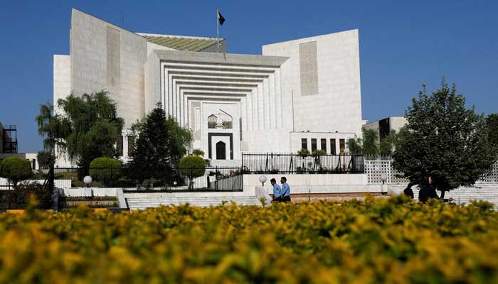 Police officers go through the Supreme Court building, in Islamabad on April 6, 2022. - Reuters