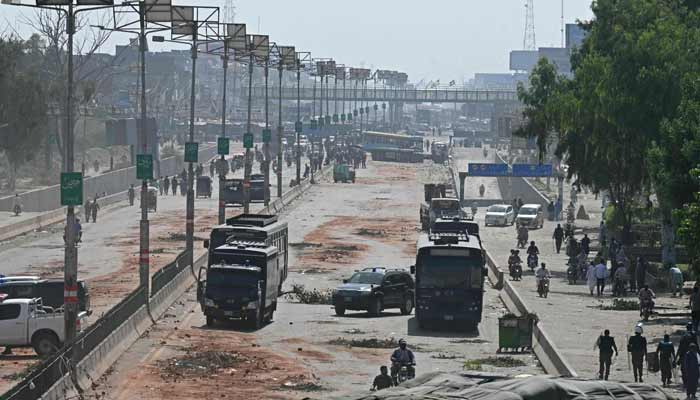 Police personnel patrol a street following a crackdown on activists of the Tehreek-e-Labbaik Pakistan (TLP) party during an anti-Israel protest in Muridke on October 13, 2025. – AFP