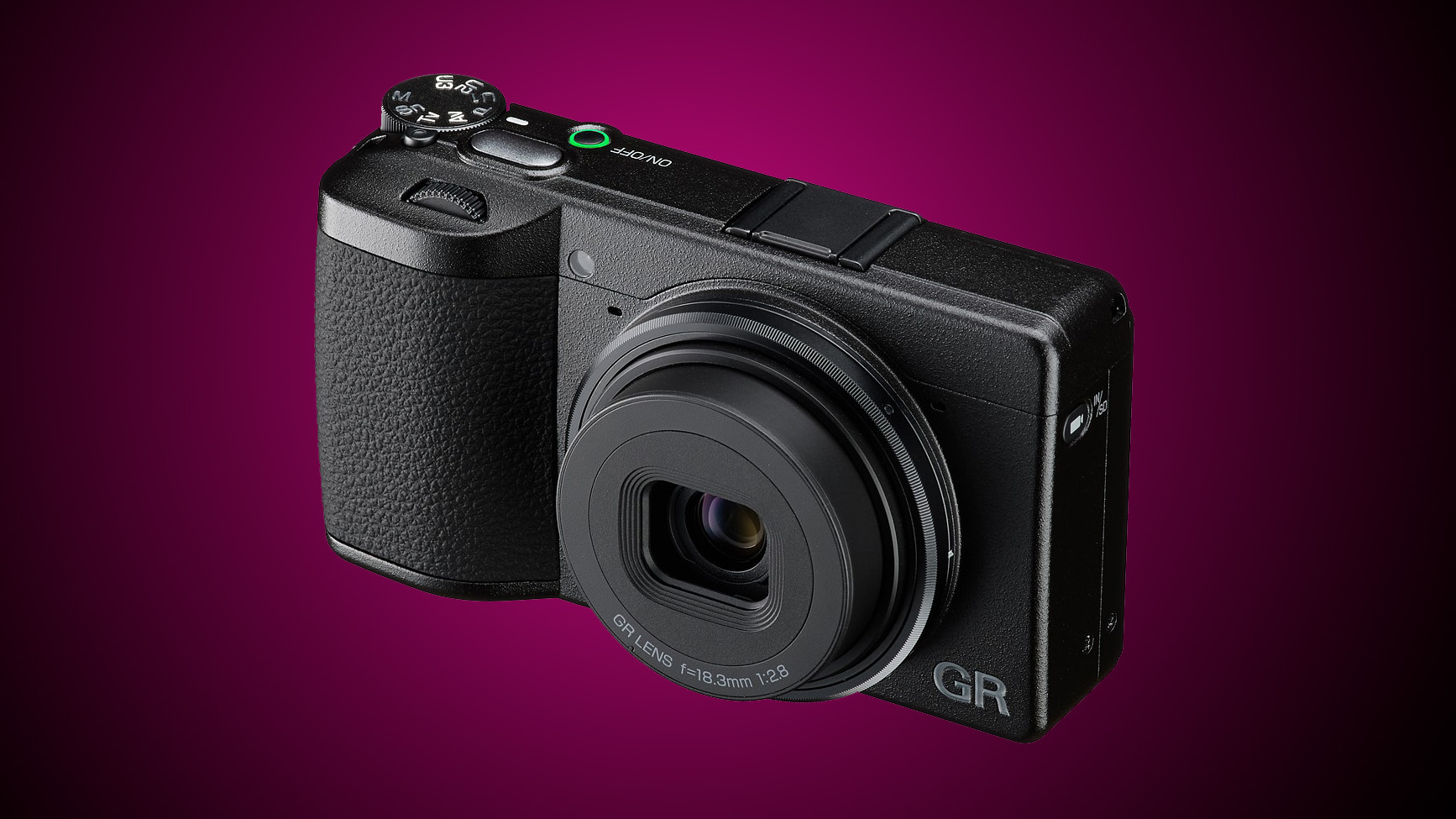 A Ricoh compact camera against a gradient purple background
