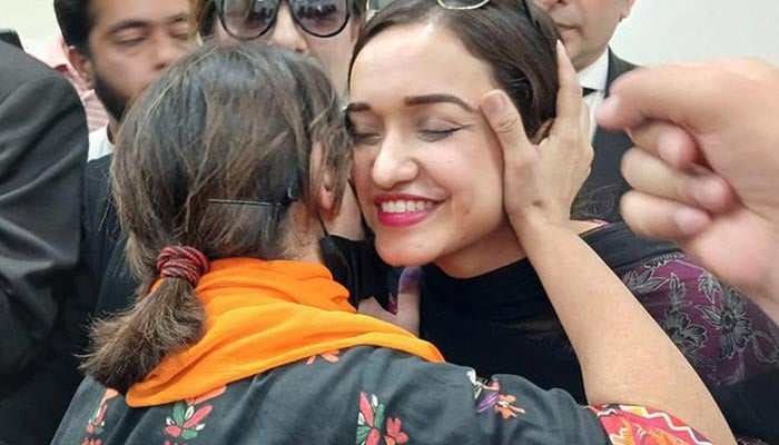 PTIAM Javed party activist meets other members during his brief launch in Islamabad on July 14, 2024.— X/@Seemabiatahir