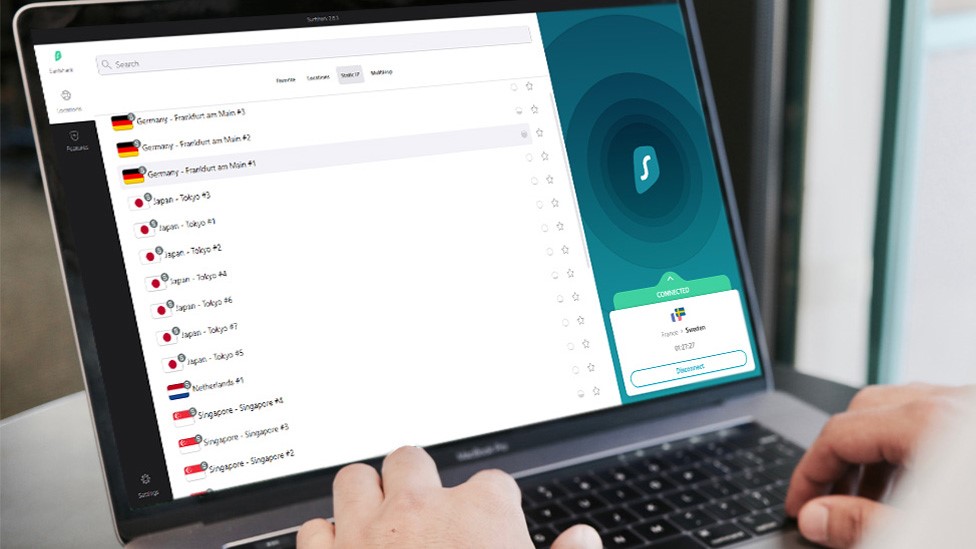 A Surfshark user choosing between multiple server regions on his laptop