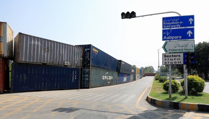 A view of shipping containers used to block the area leading to Parliament House, in Islamabad, on October 4, 2024. – Reuters