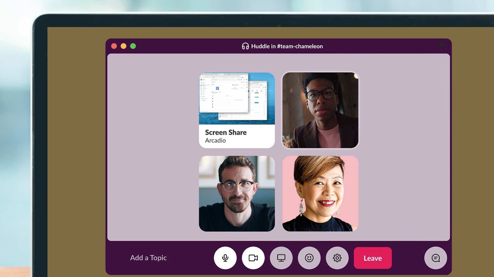 A laptop screen showing a Slack meeting