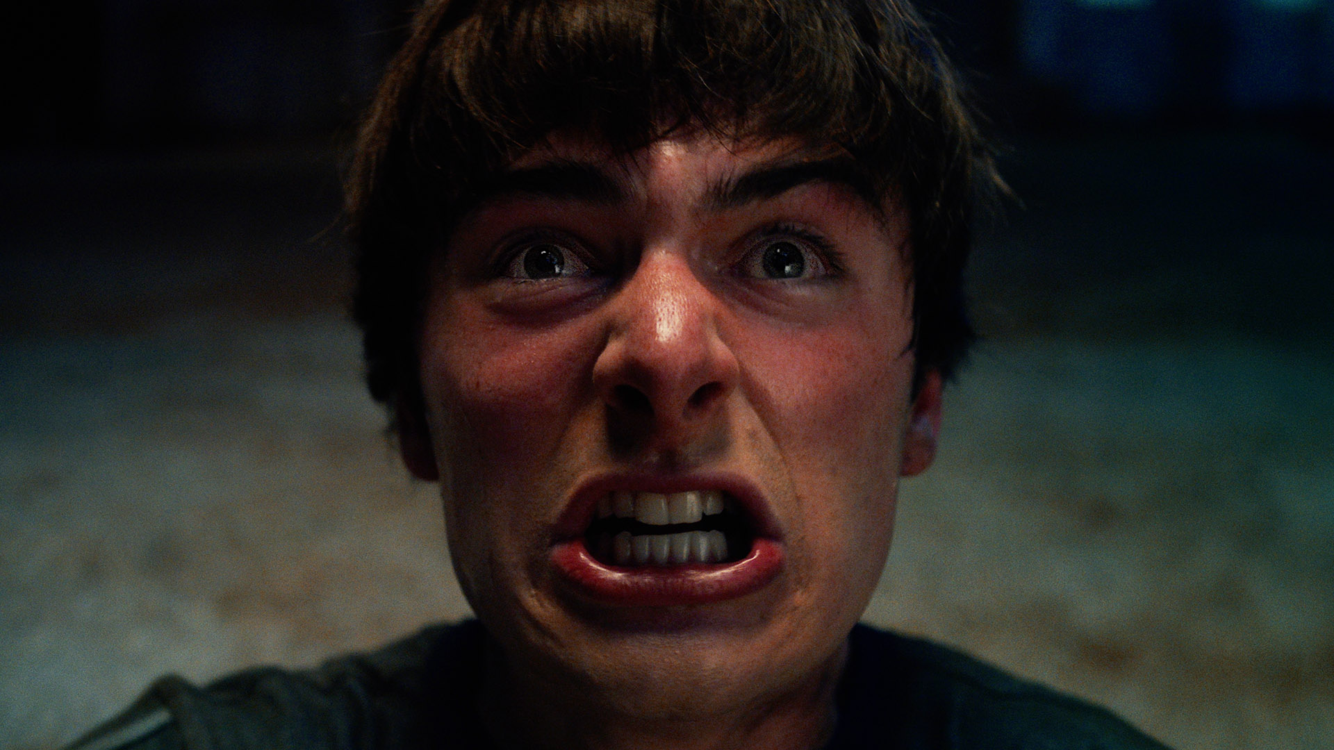 A close-up of Will Byers about to scream in Stranger Things season 5