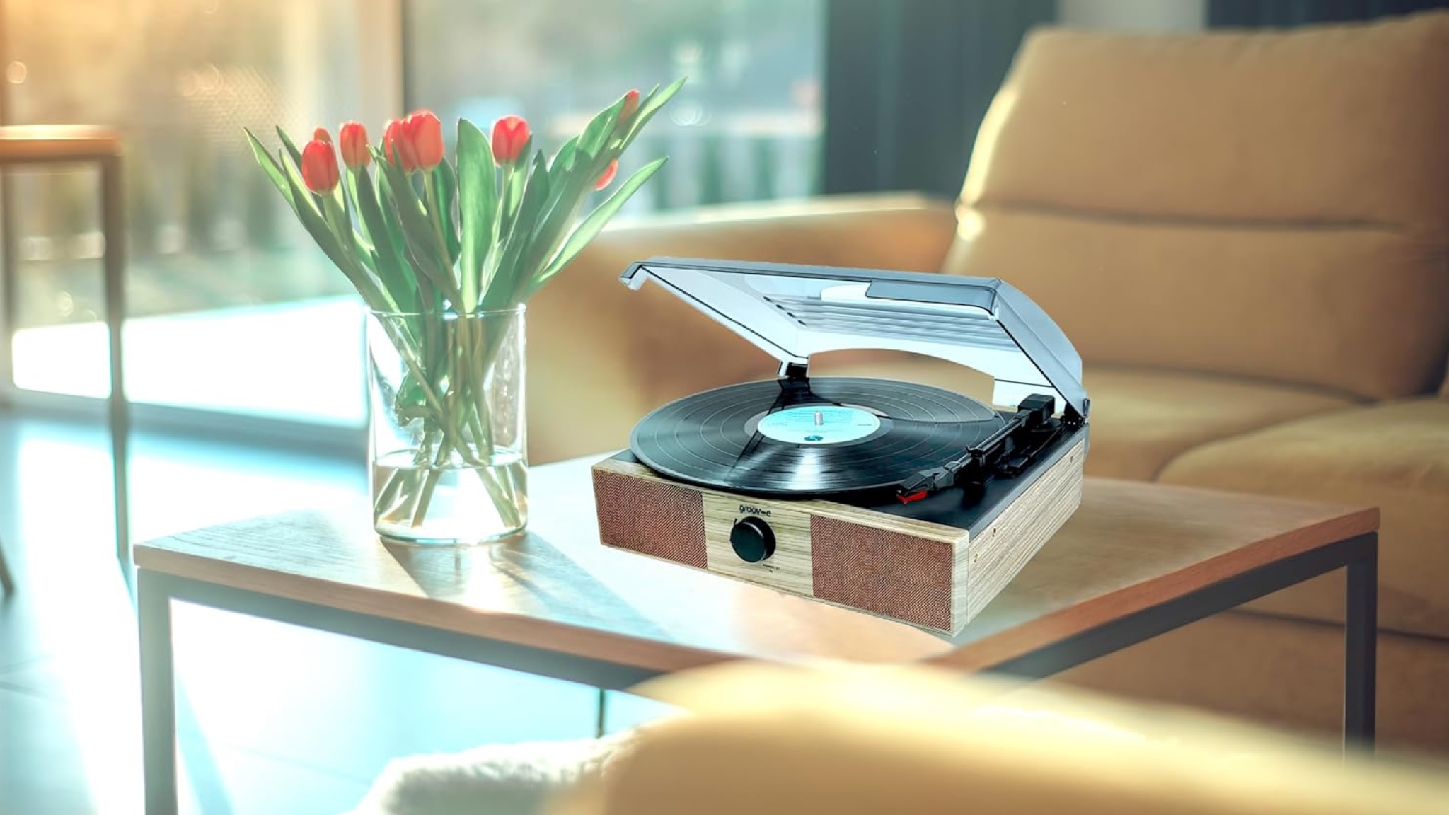 A very little convincing image that shows the Groov-E vintage spinning spinner next to the tulips on a wooden coffee table.