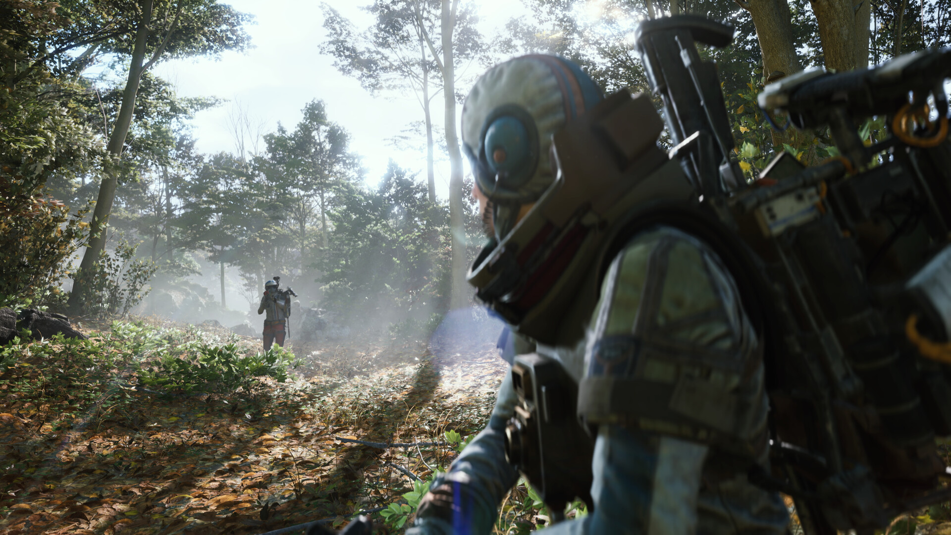 A soldier hides in a forest as an enemy approaches in the distance.
