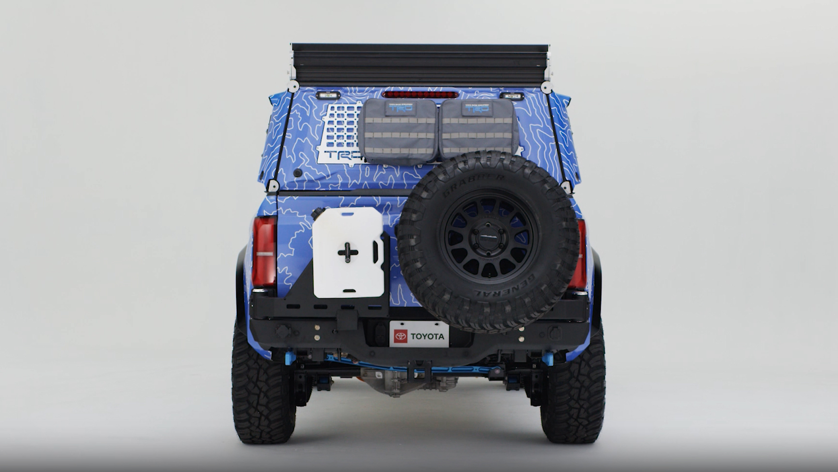 A Tacoma H2-Overlander pickup truck in a studio