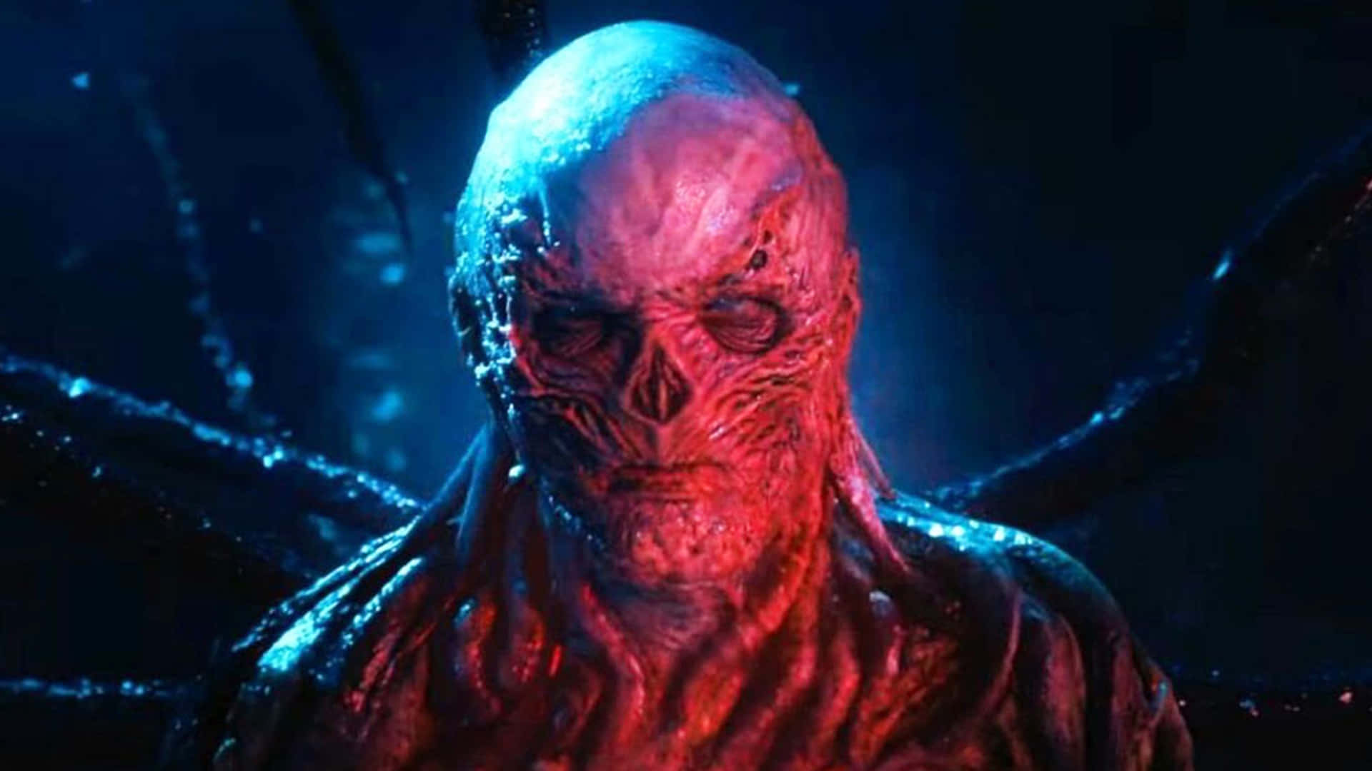 A close-up of Vecna ​​bathed in red light in Stranger Things season 4