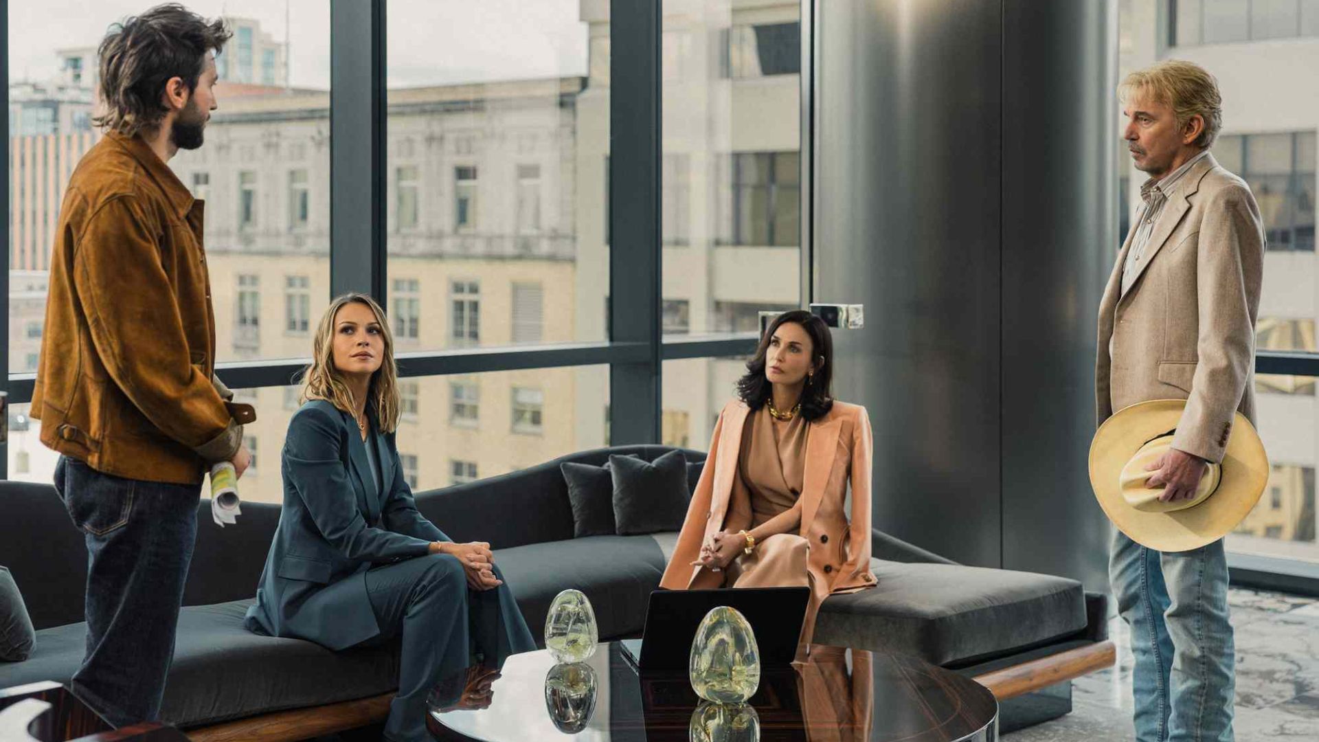 The Landman cast in a boardroom