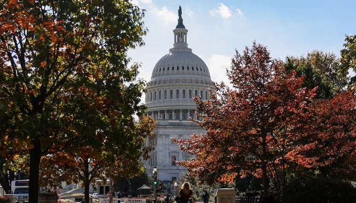 The US Capitol building is framed among trees with fall foliage, weeks after the continued US government shutdown, in Washington, DC, the United States, on October 27, 2025. – Reuters