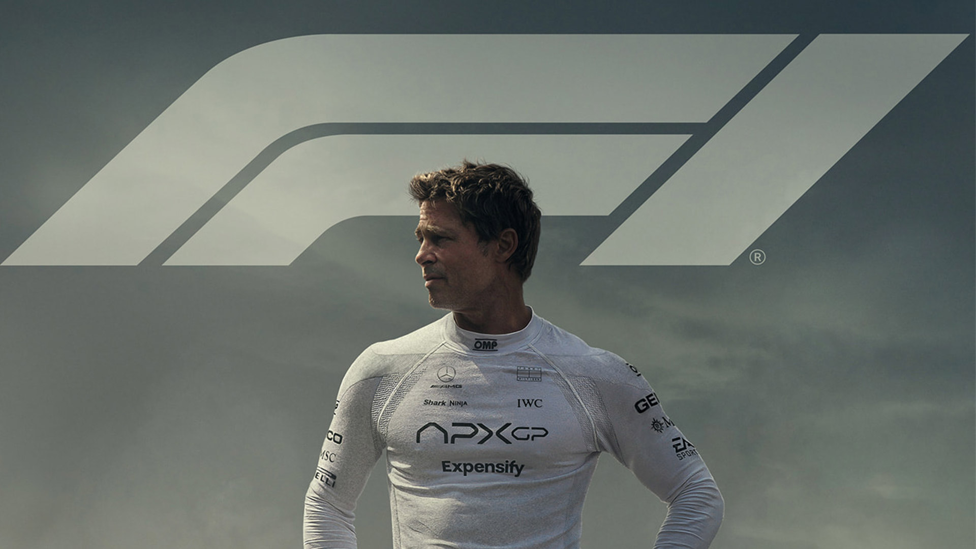 Brad Pitt looks over his right shoulder with 'F1' written behind him