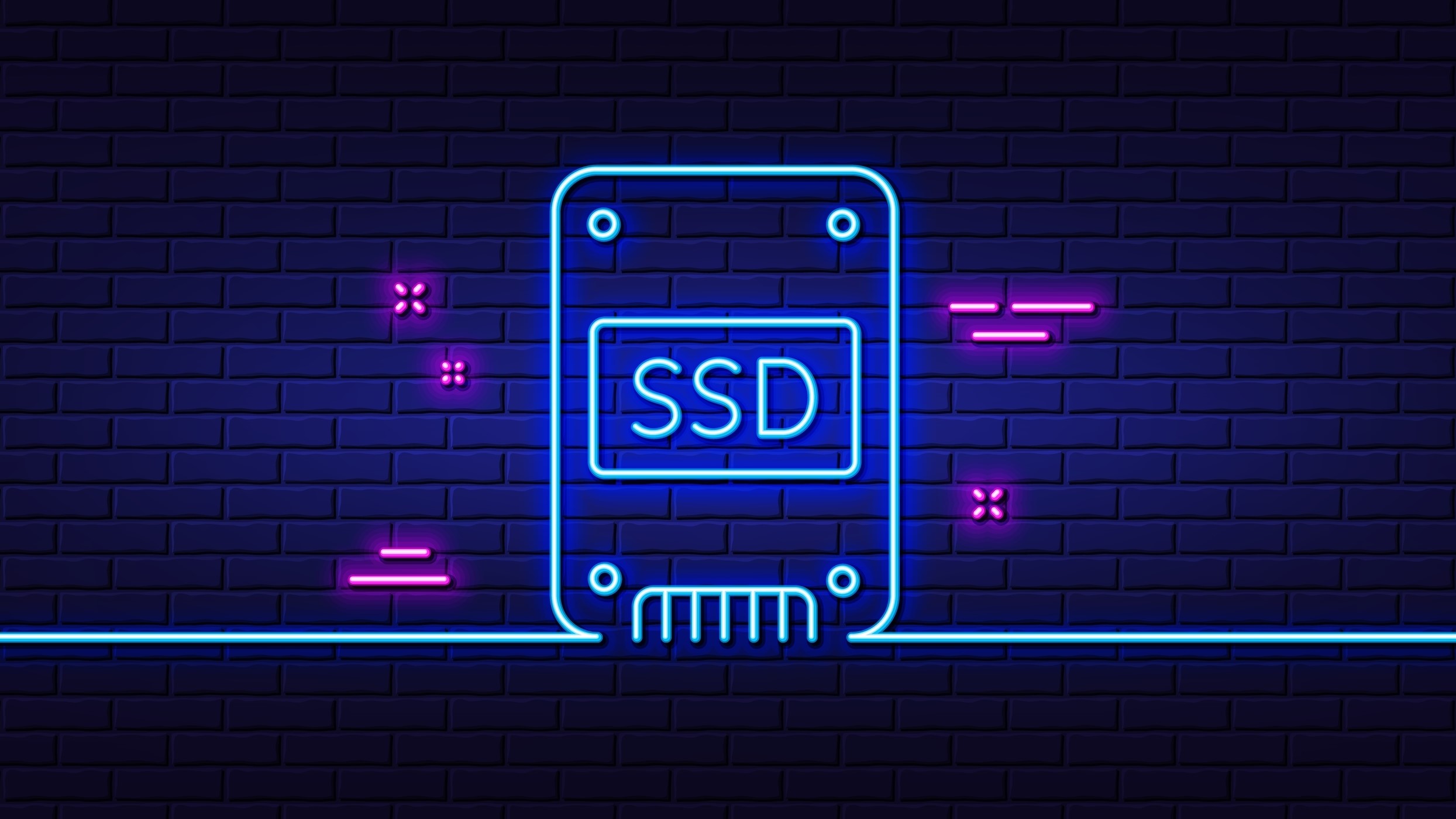 Neon artwork of a stylized SSD against a brick wall.