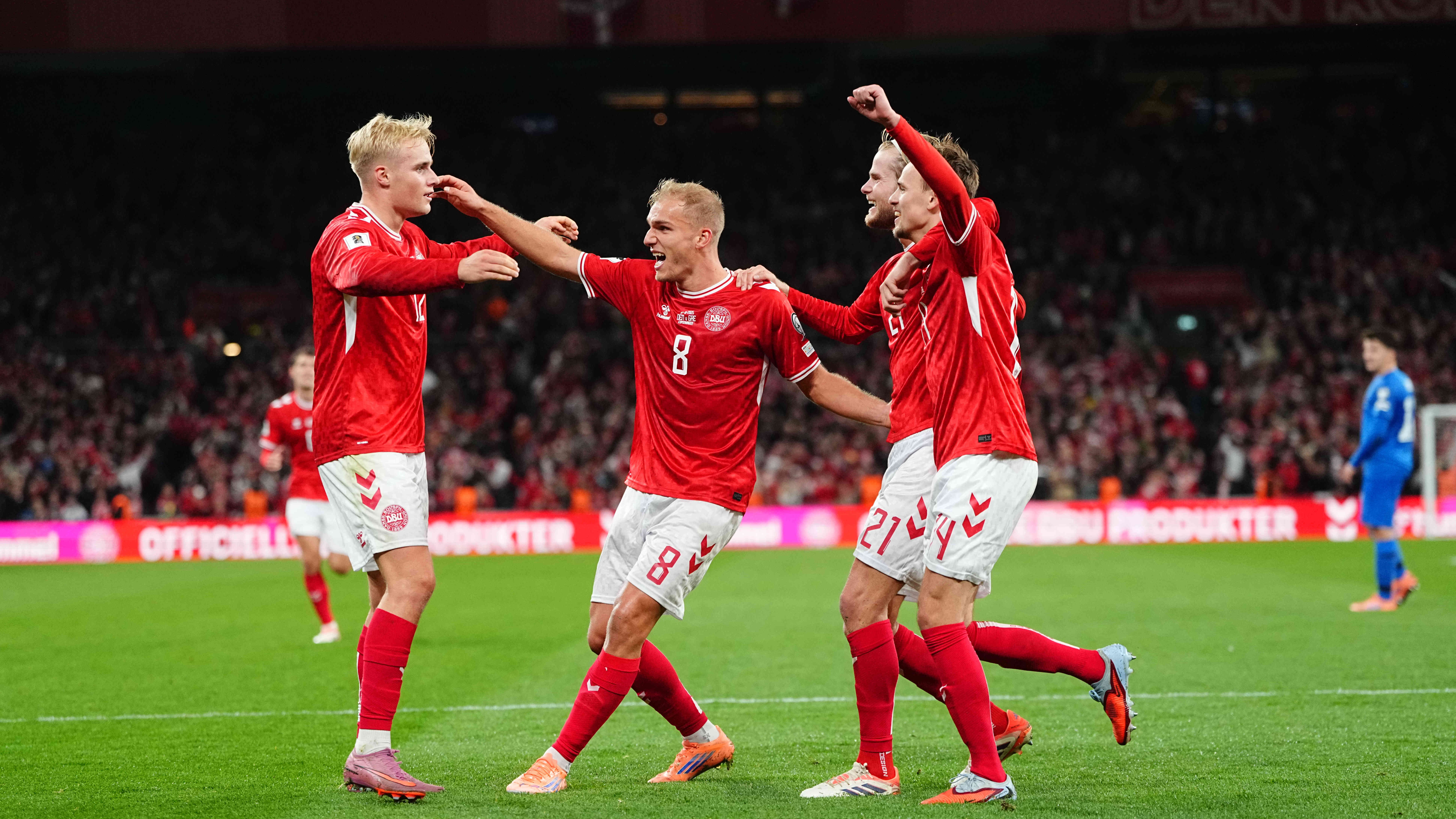 Mikkel Damsgaard of Denmark scores and celebrates his team's third goal during the UEFA World Cup qualifying match between Denmark and Greece at Parken Stadium in Copenhagen, Denmark, on October 12, 2025.