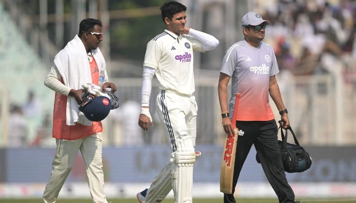 India captain Shubman Gill (centre) returns to the pavilion after his injury during the second day of the first Test cricket match between India and South Africa at Eden Gardens in Kolkata, India, on November 15, 2025. – AFP