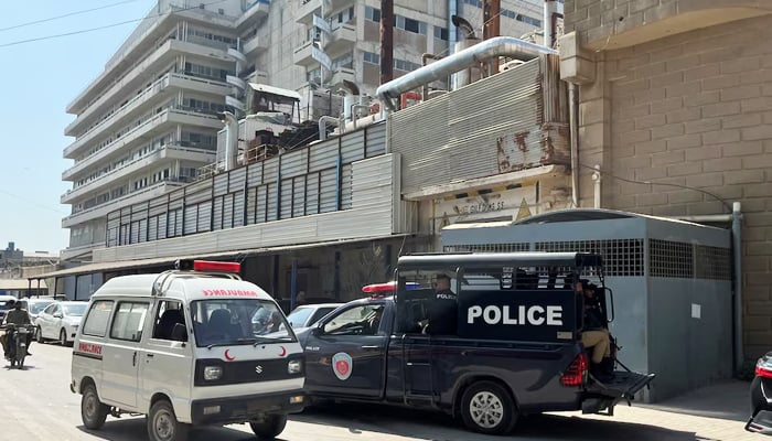 View of the police mobile and an ambulance in front of a factory in Karachi, on November 5, 2024. – Reuters
