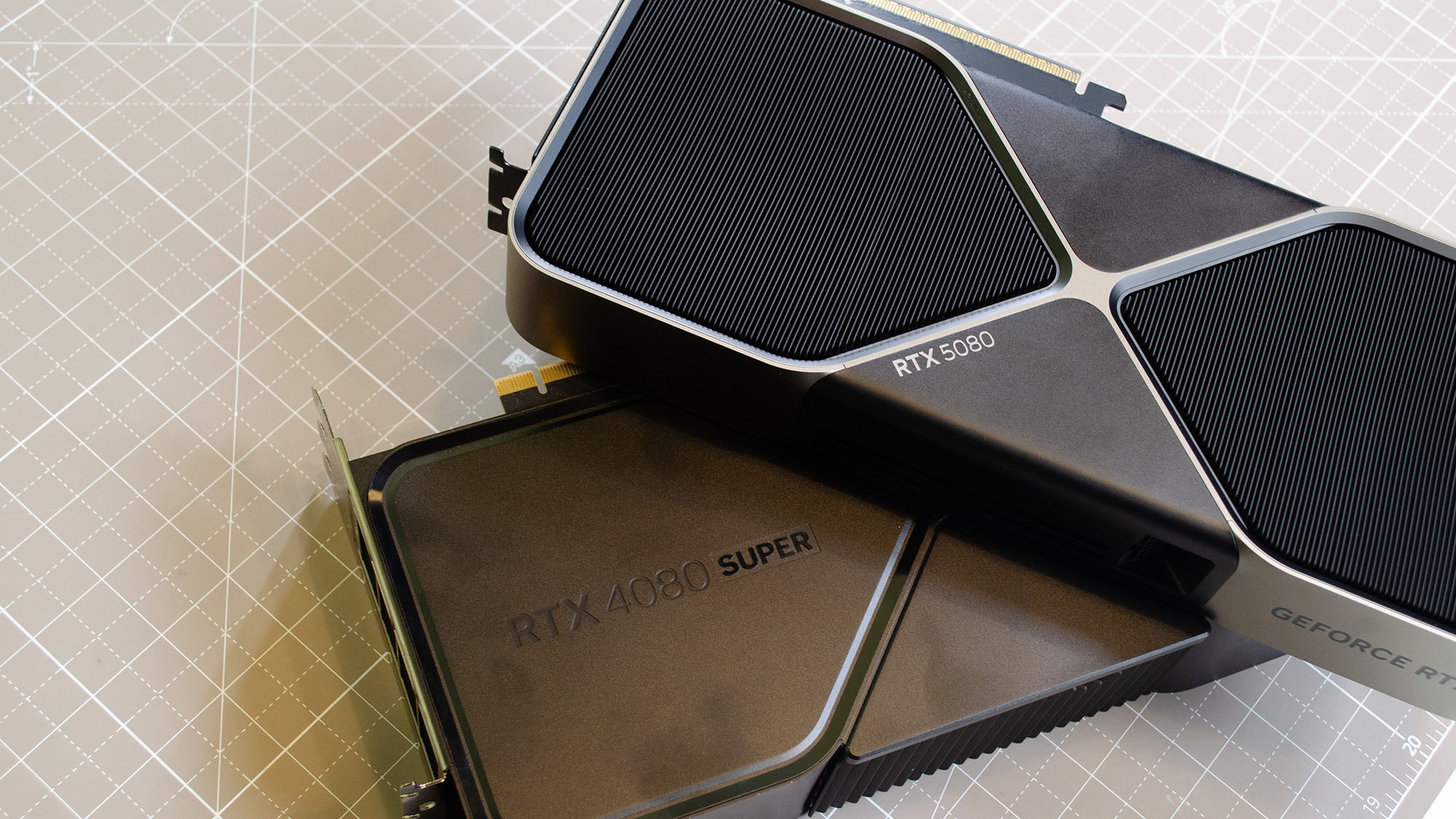 An Nvidia GeForce RTX 5080 supported by an RTX 4080 Super