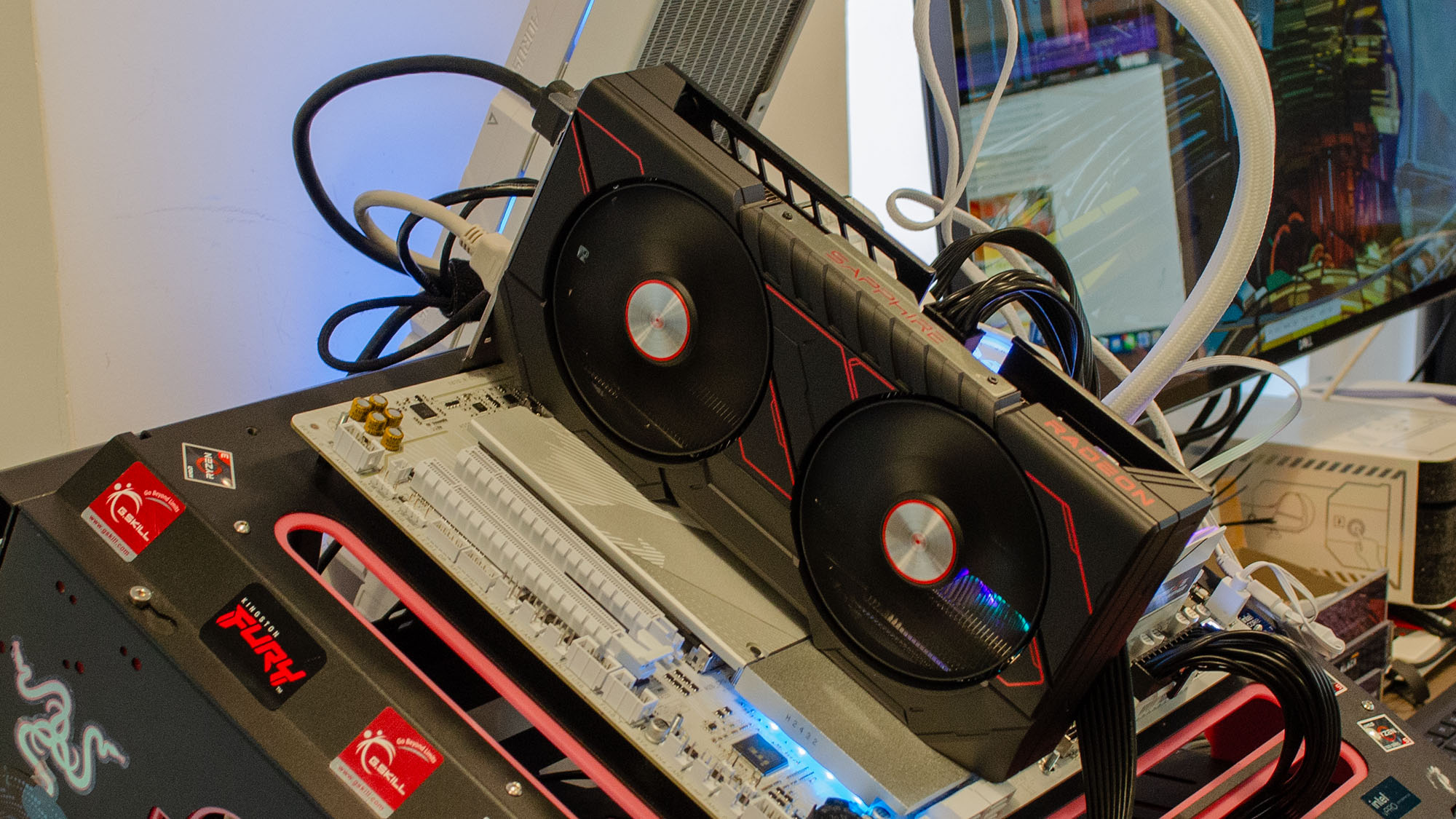 An AMD Radeon RX 9060 XT inserted in a test bench