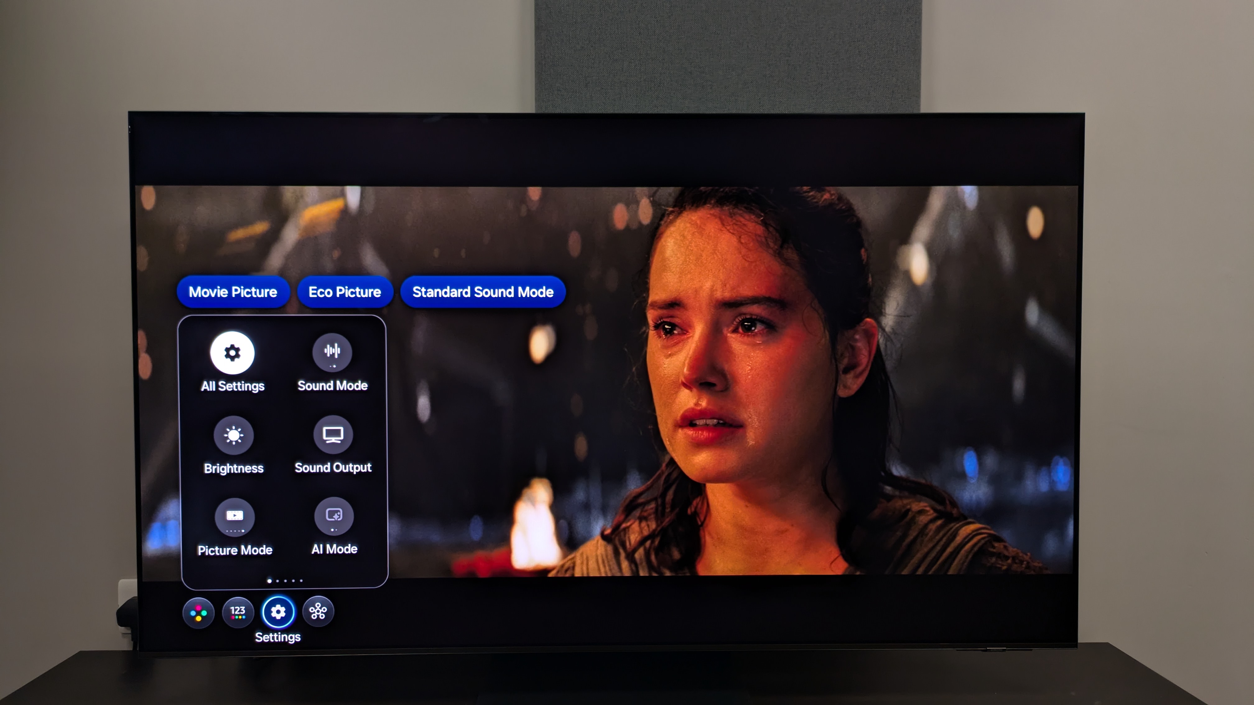 Samsung S95F with Stars Wars The Last Jedi on screen with settings menu overlay