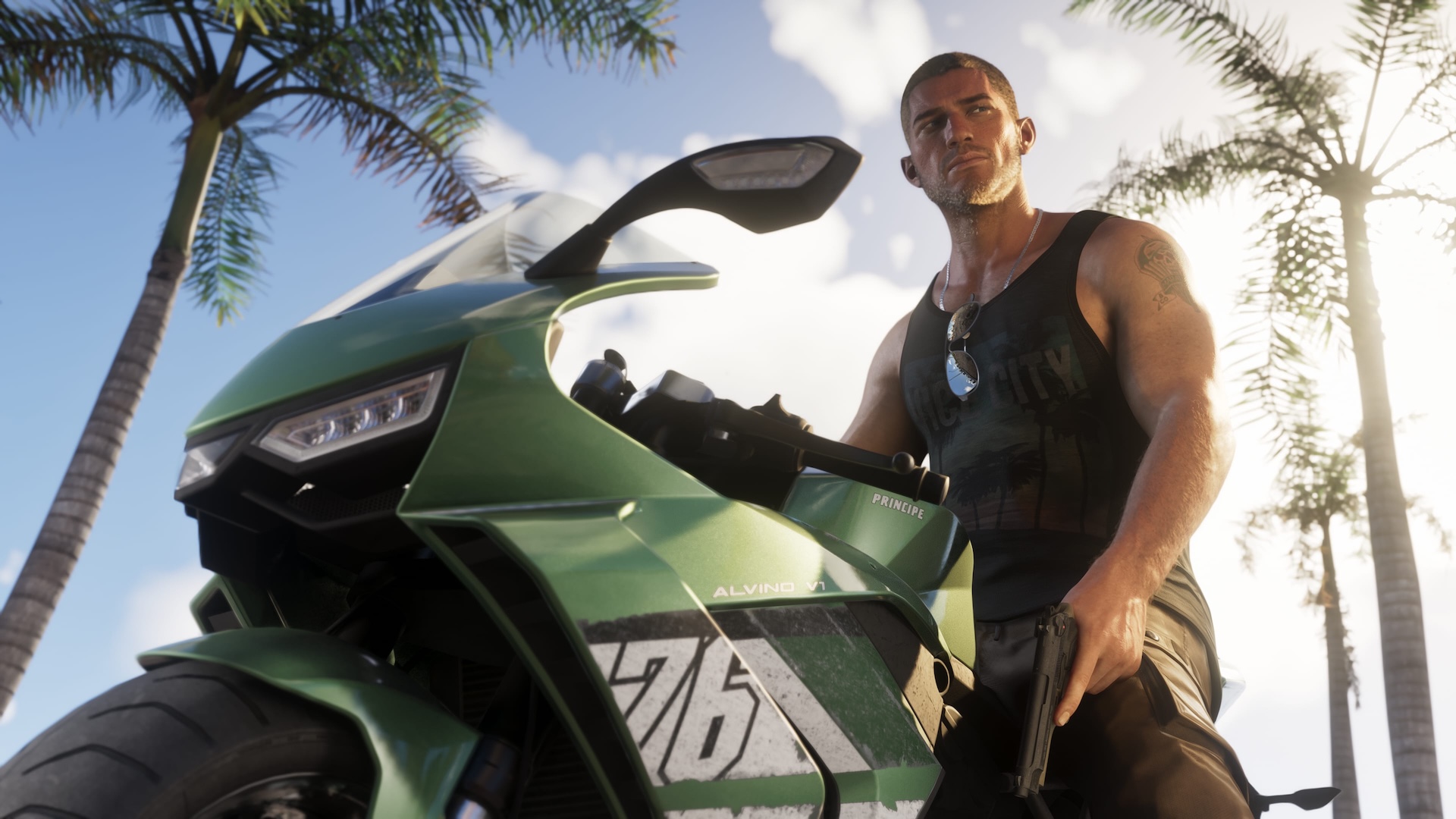 Jason Duval sitting on a green superbike, with palm trees behind him