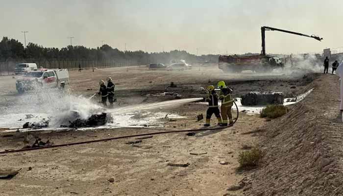 Firefighters work at the scene of a crash involving an Indian-made HAL Tejas fighter jet at the Dubai Airshow, United Arab Emirates, Nov. 21, 2025, in this image obtained from social media. – Reuters