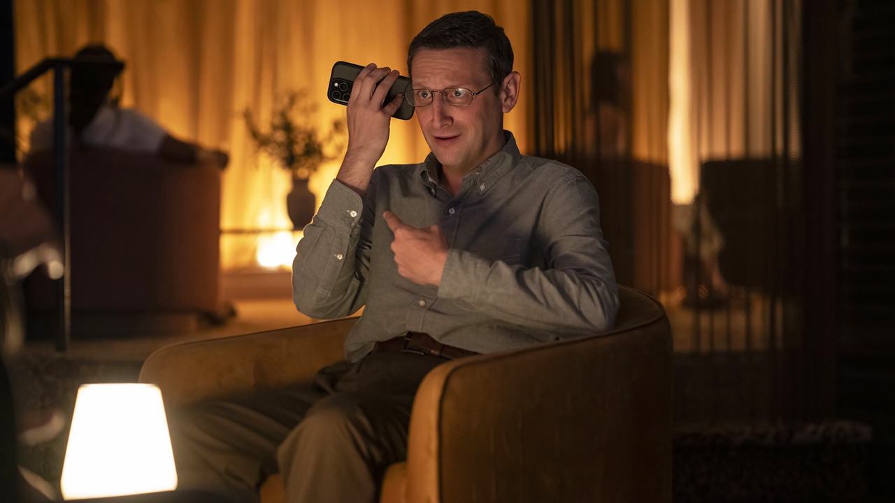 Ron Trosper sitting and talking on mobile phone at The Chair Company