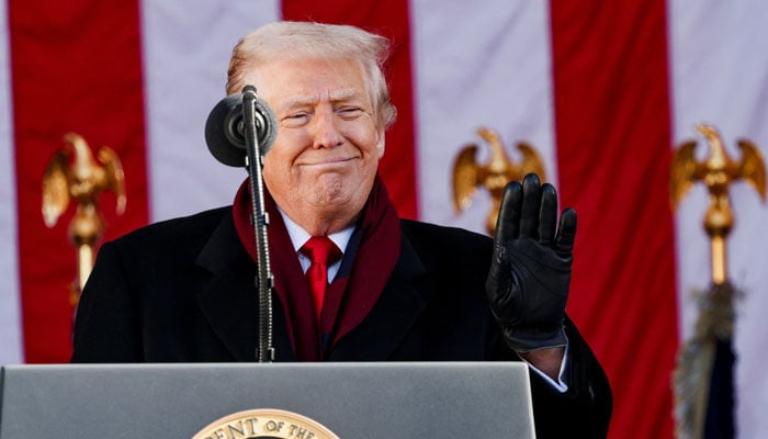 U.S. President Donald Trump waves to the audience during a Veterans Day ceremony at Arlington National Cemetery in Arlington, Virginia, the United States, Nov. 11, 2025. – Reuters