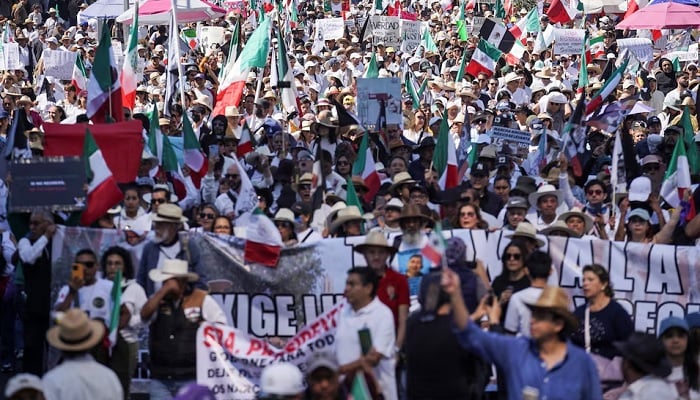 Demonstrators march to protest against insecurity and corruption in the country, in Mexico City, Mexico, on November 15, 2025.— Reuters