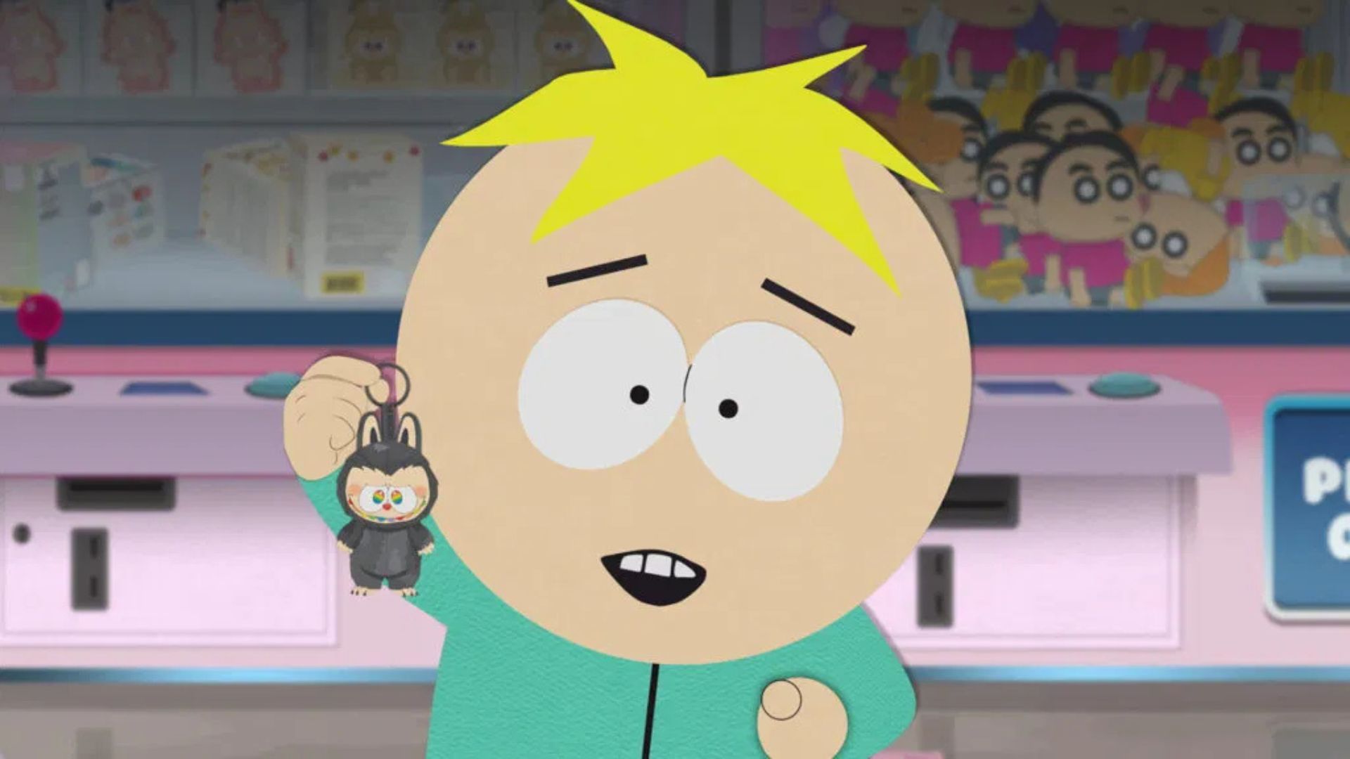 Butters holds a Labubu keychain