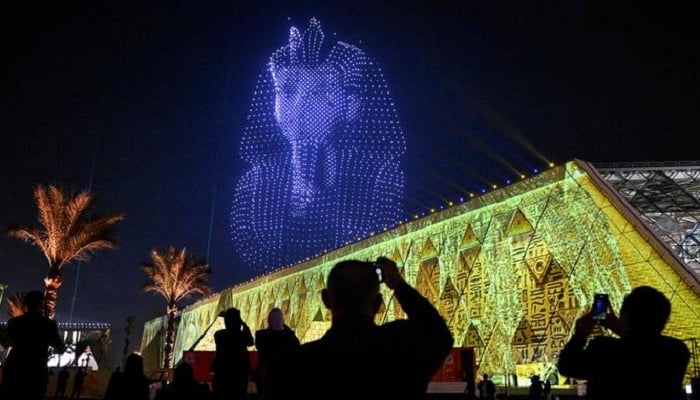 A drone light show depicts the ancient sarcophagus of King Pharaoh Tutankhamun during the opening ceremony of the Grand Egyptian Museum (GEM), near the Giza pyramid complex, in Giza, Egypt, November 1, 2025. – Reuters