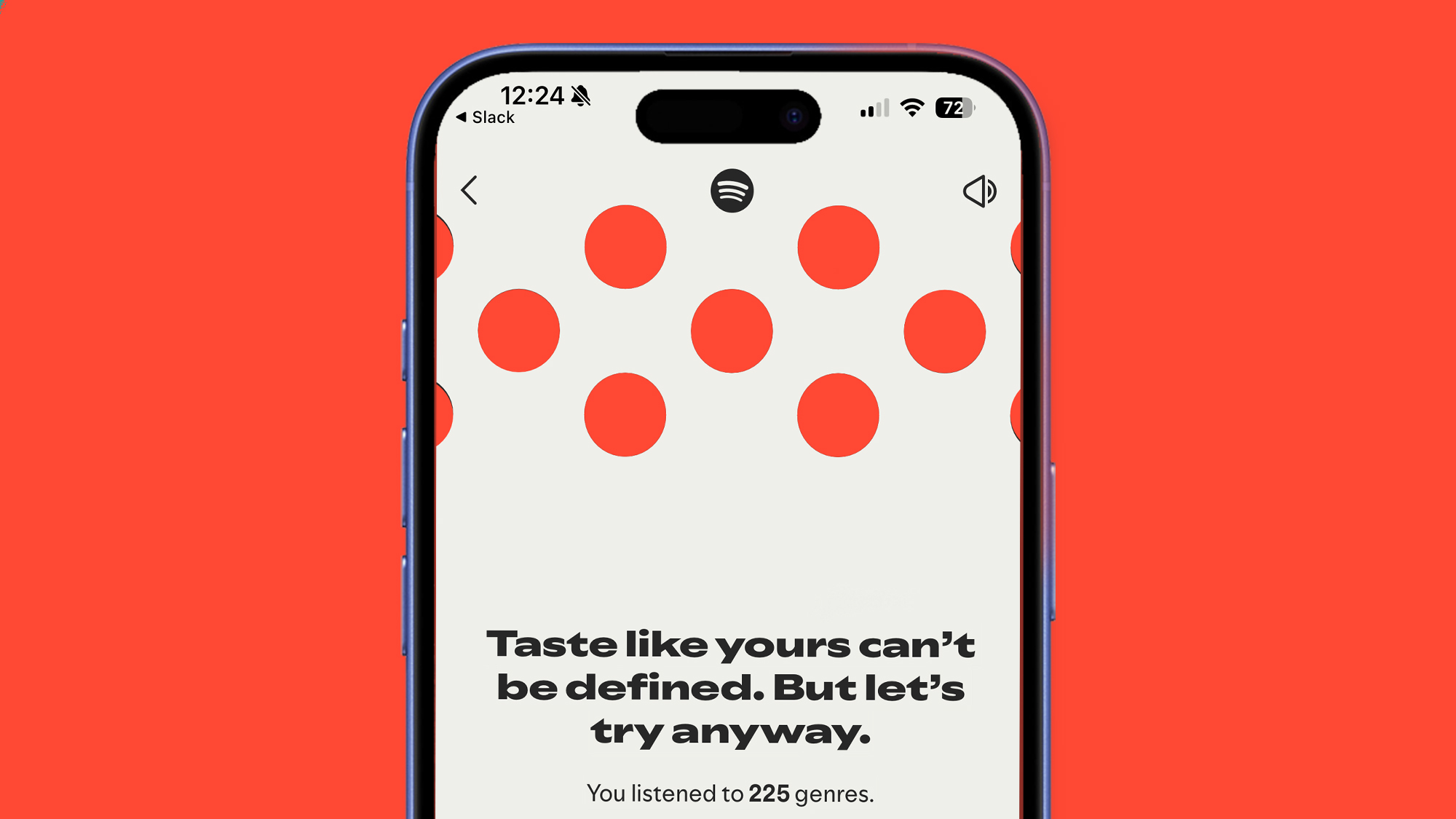 A phone on a red background showing the Spotify web player.