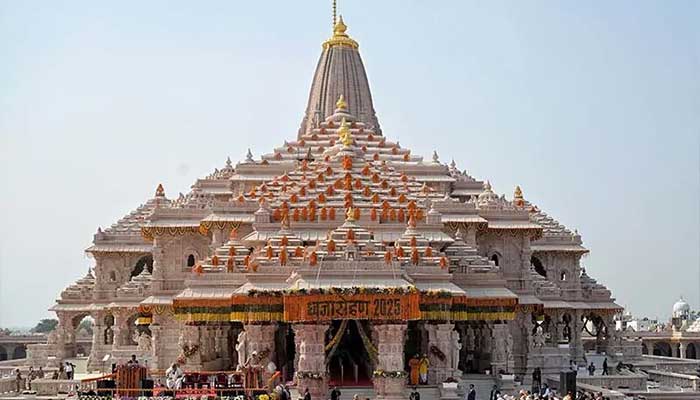 This photograph, taken and released by India's Press Information Bureau on November 25, shows Indian Prime Minister Narendra Modi (center) participating in a flag-raising ceremony to mark the completion of the construction of the Ram temples in Ayodhya, India. – Reuters
