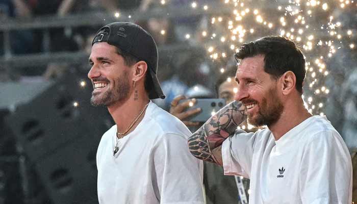 Argentine footballers Lionel Messi (right) and Rodrigo De Paul arrive to attend an event during Messi's GOAT Tour at the Wankhede stadium in Mumbai on December 14, 2025.— AFP