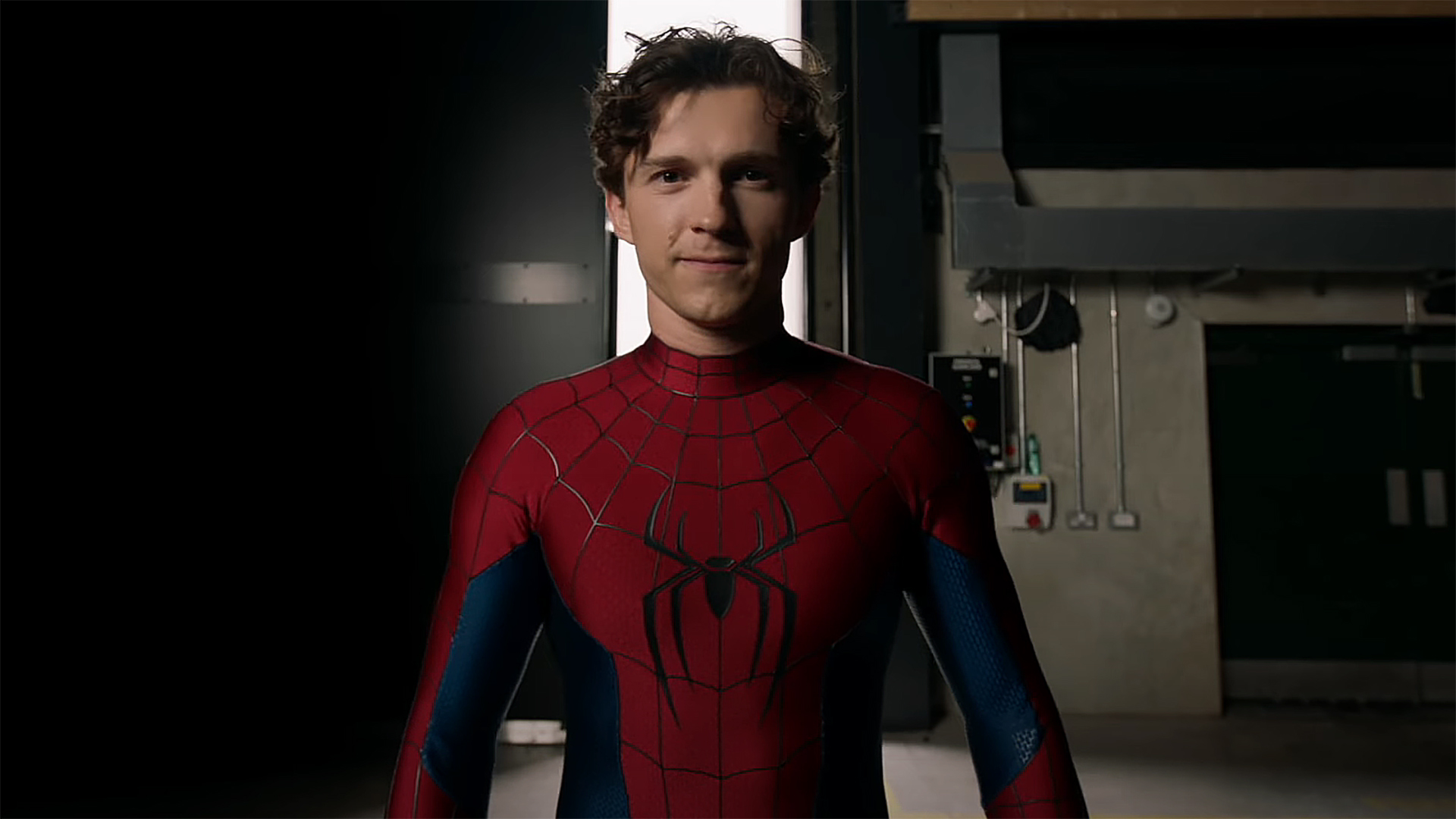 Tom Holland showing off his new Spider-Man suit and smiling in a behind-the-scenes video from Spider-Man: Brand New Day