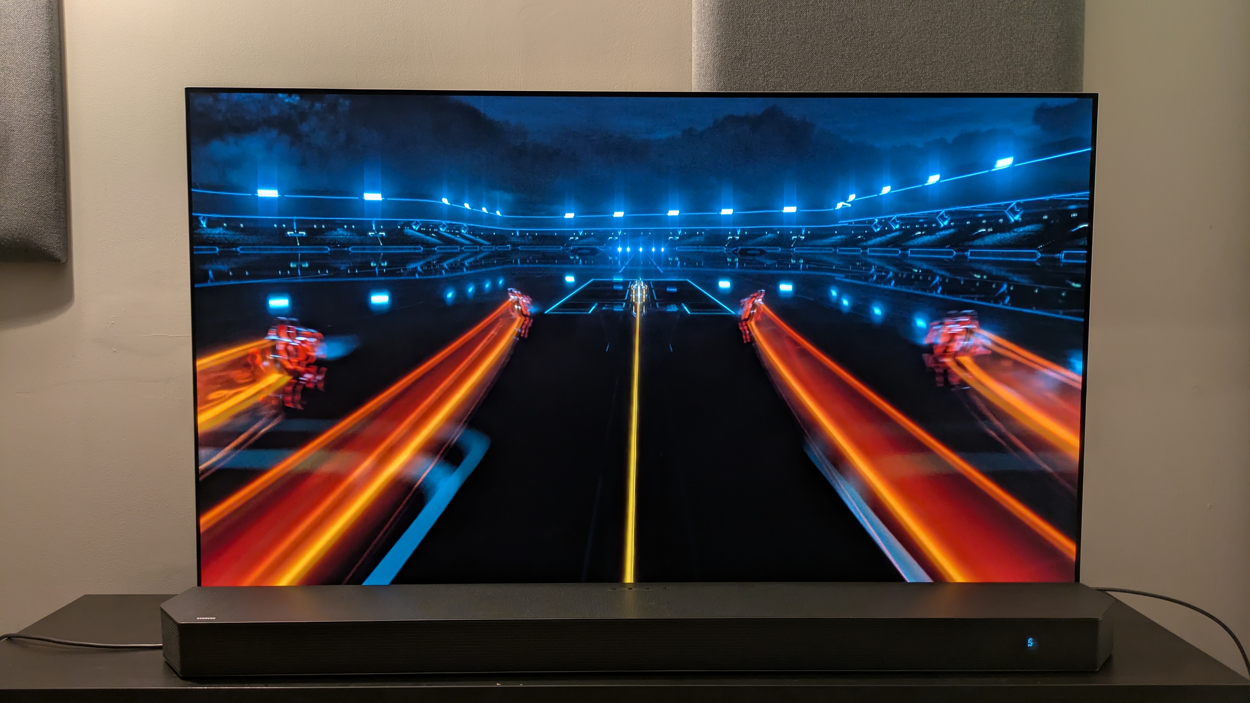 Tron: Legacy 4K Blu-ray on LG G5 showing orange light cycle traces on screen