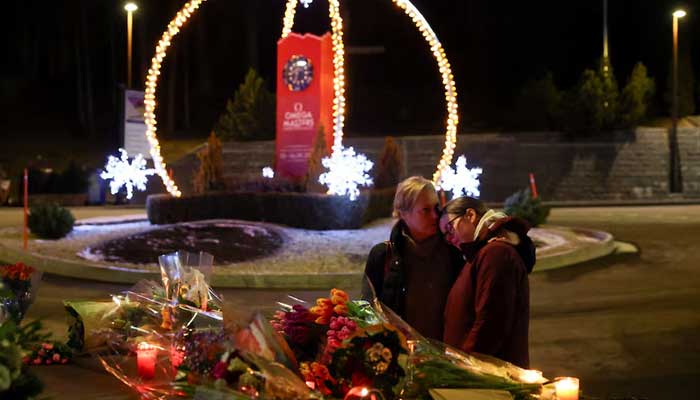 People hug near the Le Constellation bar, after a fire and explosion during a New Year's Eve party where several people died in the exclusive ski resort of Crans-Montana, southwestern Switzerland, January 1, 2026. - Reuters