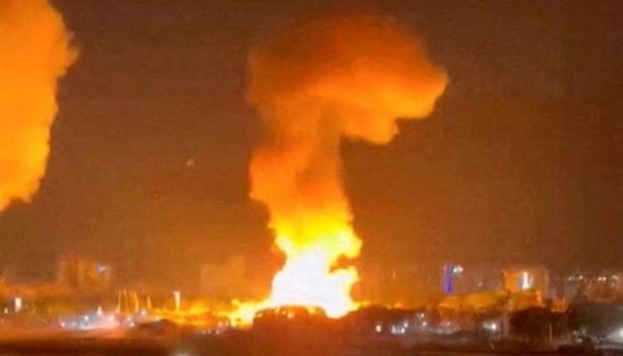 Smoke rises from explosions in Caracas, Venezuela, on January 3. – Reuters