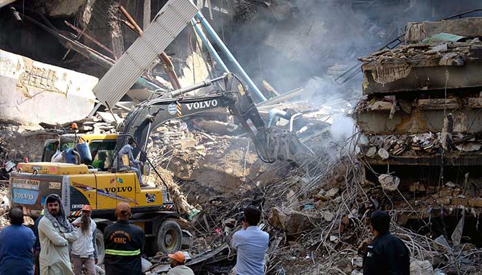 View of Gul Plaza after the fire, with heavy machinery and rescue teams operating on MA Jinnah Road, Karachi, January 20, 2026. – PPI